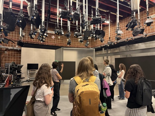 A group of students visiting an old newsroom